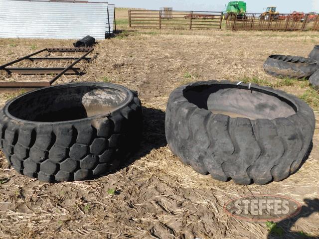 (2) rubber tire water tanks